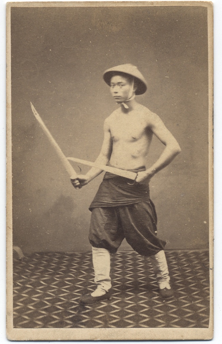 1860s photograph of a "Chinese Soldier" with butterfly swords.  Subject unknown, taken by G. Harrison Grey.