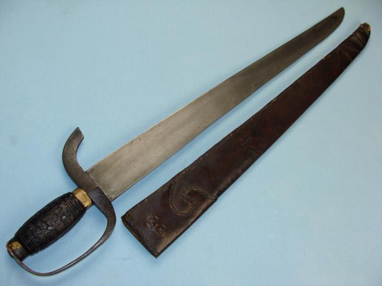 This is an interesting example of a single “hudiedao.”  It was never issued with a companion and has a fully round handle meaning that it cannot be slid into a scabbard besides another weapon.  Short swords such as these were often issued to milita members who were armed with rattan shields.  While not strictly the same as a hudiedao, its clear that this weapon is taking its styling cues from these other swords.  The style of its leather scabbard, hilt and hand-guard are all identical to what was see on period “butterfly swords.”  This example measures 60 cm in length and would have been a good general short-range weapon.  Photo courtesy of http://www.swordsantiqueweapons.com.