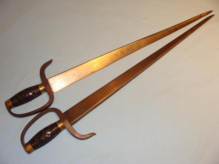 A very nice set of mid. 19th century hudiedao.  These pointed stabbing blades are 63 cm long, 40 mm wide at the base, and the spine in 14 mm across, giving the entire weapon a strong triangular profile.  Image courtesy of http://www.swordsantiqueweapons.com.