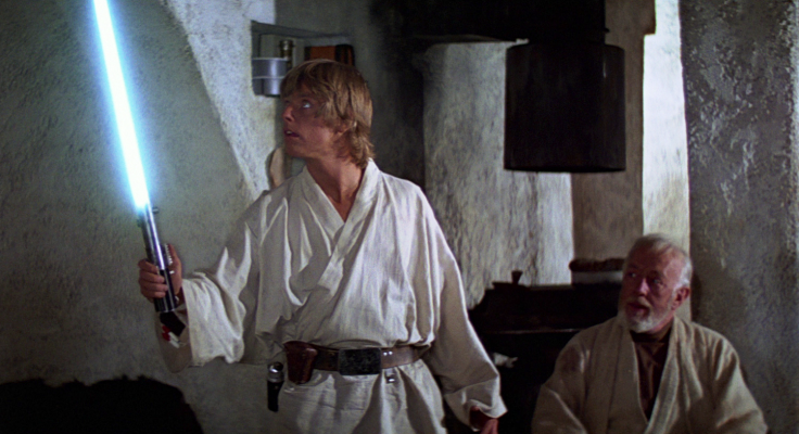 Luke receiving his fathers lightsaber in Episode IV: A New Hope (1977).